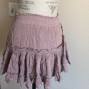 Dusty rose ruffle skirt with silver striping.